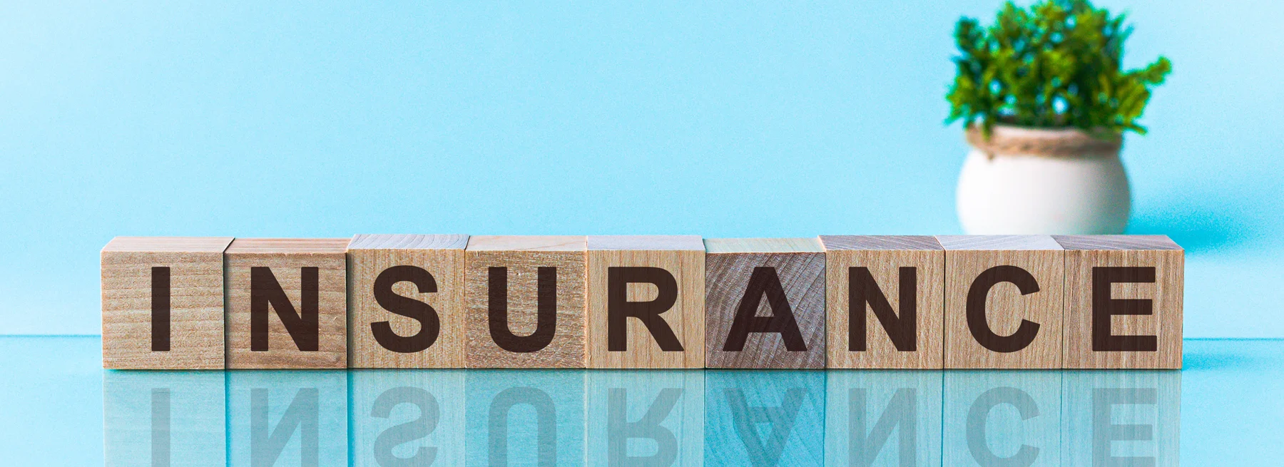 Insurance Carrier image in wooden blocks on a blue background